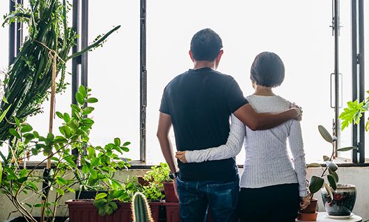 Couple looking out of a window