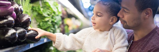 Father and daughter grocery shopping