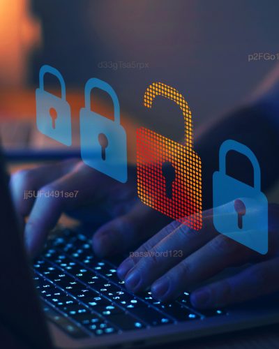 Cyber criminal typing on laptop keyboard[