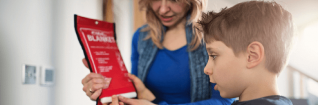 Mom teaching son about fire safety