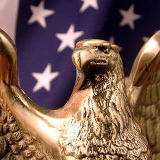 American flag with bronze eagle