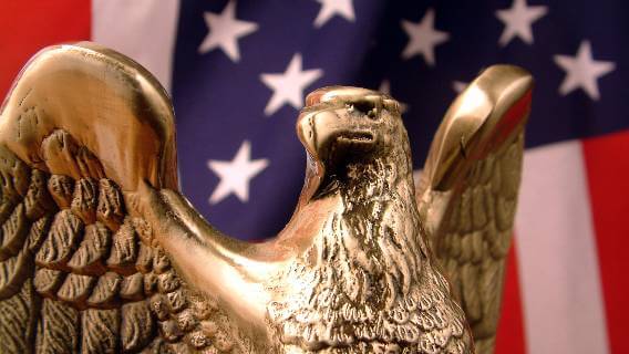 American flag with bronze eagle