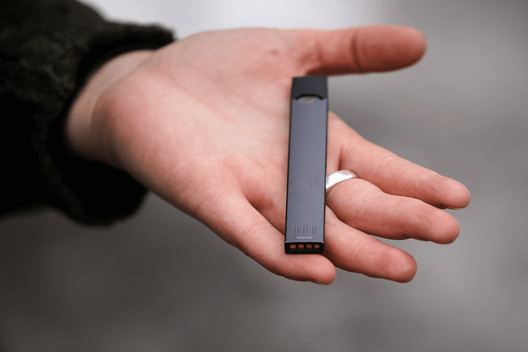 JUUL e-cigarette in palm of hand