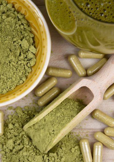 An image of kratom in powder, pill and drink format.