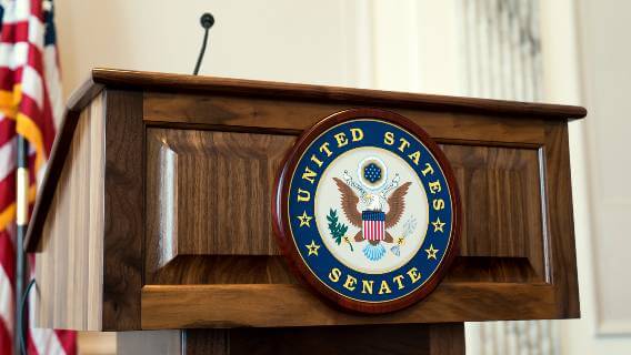 U.S. Senate podium with logo and flag