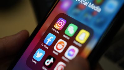 Phone with social media apps on screen