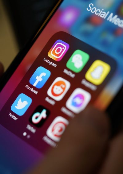 Phone with social media apps on screen