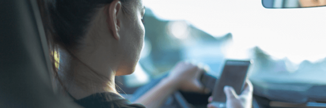 Teenage girl texting and driving