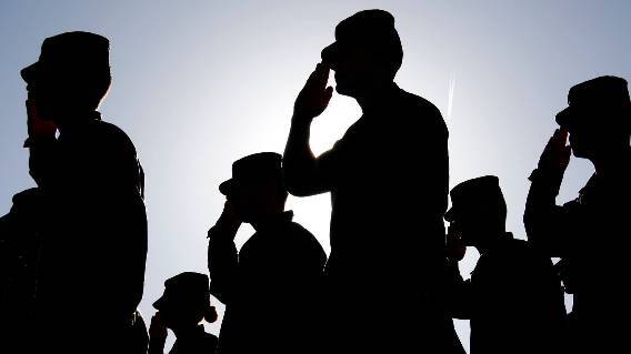 Military personnel saluting