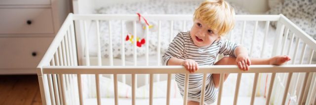 Child climbing out of a crib
