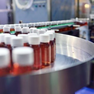 Drug bottles on assembly line