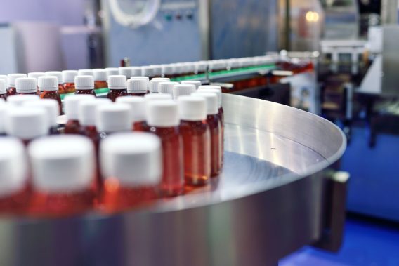 Drug bottles on assembly line