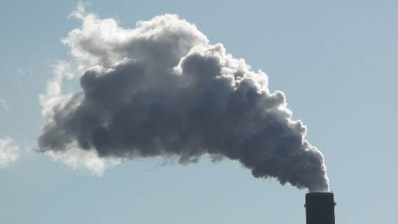 Smokestack spewing cloud of emissions