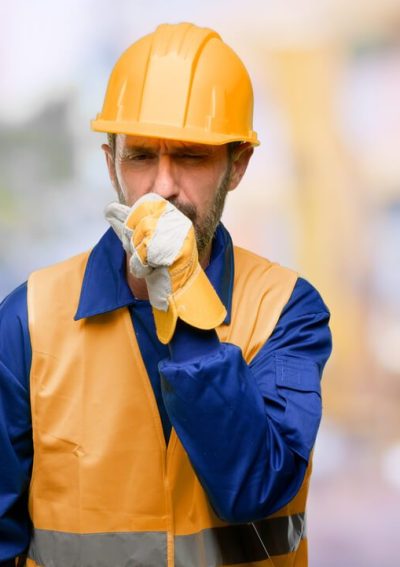 Construction worker coughing