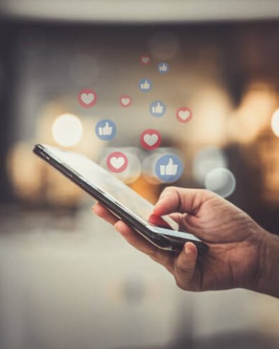 Woman using facebook on smart phone