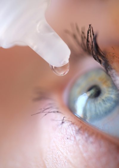 Eye drops going into woman's eye