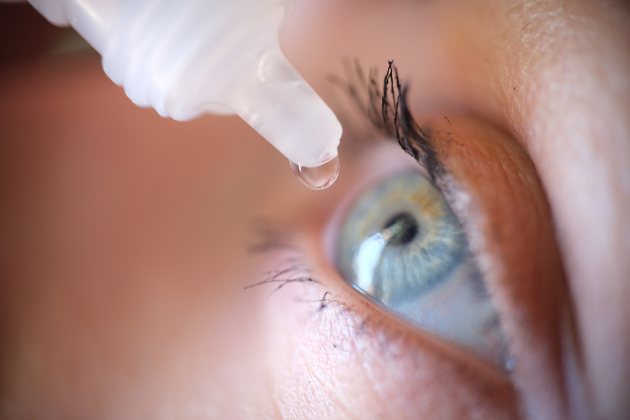 Eye drops going into woman's eye