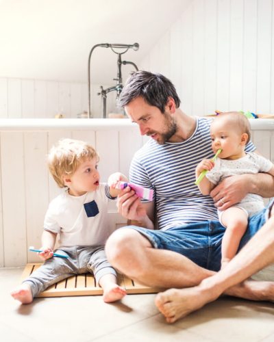 father with kids in the bathroom