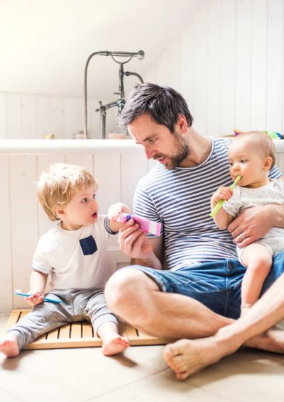 father with kids in the bathroom