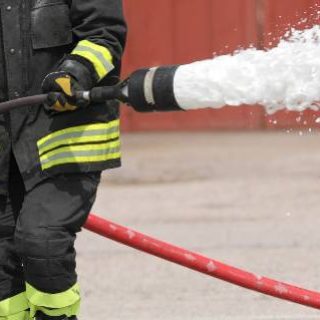 Fire personnel with foam