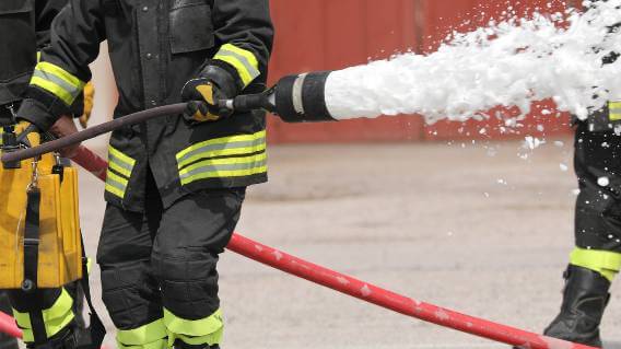 Fire personnel with foam