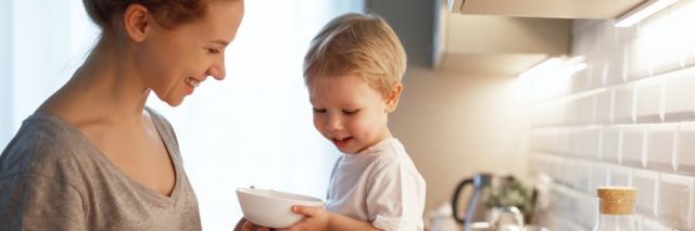 Mother and child cooking food