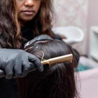 Hair stylist straightening hair