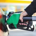 Person pumping gas into their car.