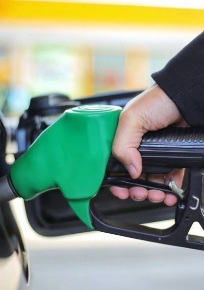 Person pumping gas into their car.