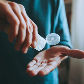 Man using hand sanitizer