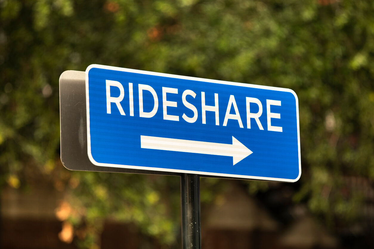 Blue rideshare road sign