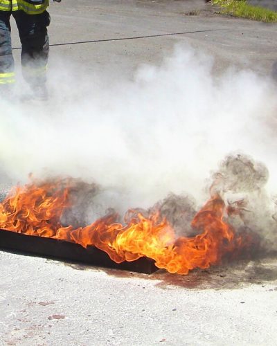 Aqueous film forming foam being sprayed over a fire