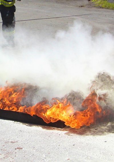 Aqueous film forming foam being sprayed over a fire