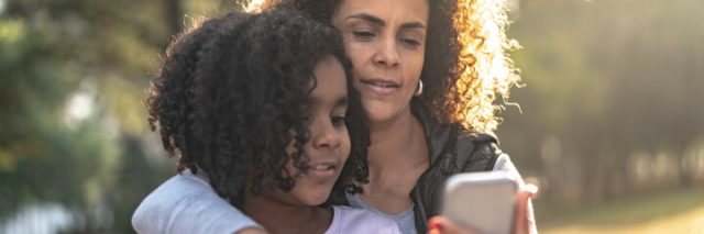Mom explaining smartphone safety to her child