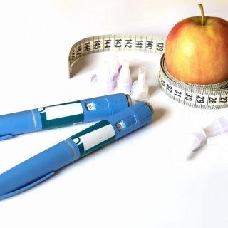 Ozempic pen with an apple