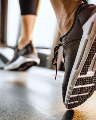 Woman running on Peloton treadmill
