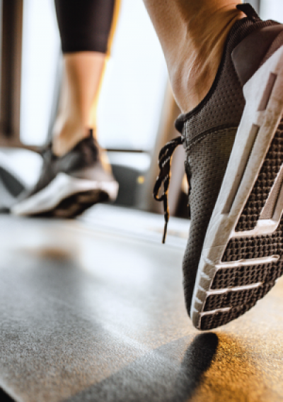 Woman running on Peloton treadmill