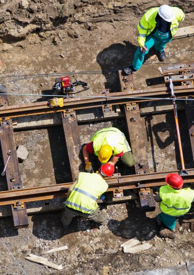 construction workers are building a new railway line