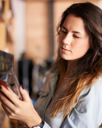 girl reading label