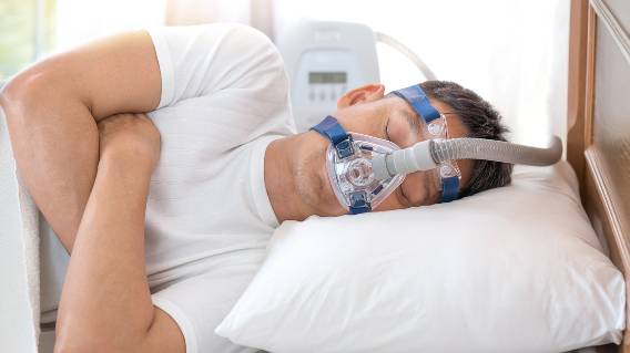 Man using CPAP machine