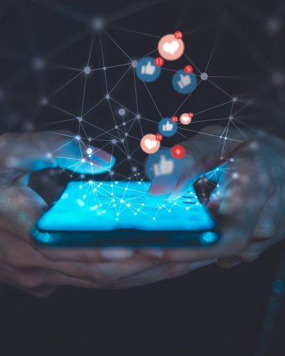 A girl using social media apps on her phone.