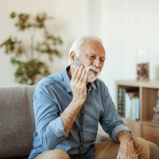 Elderly Man with tooth pain