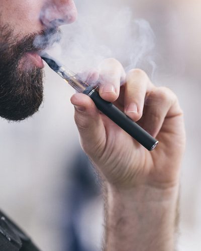 Man smoking from a vape pen