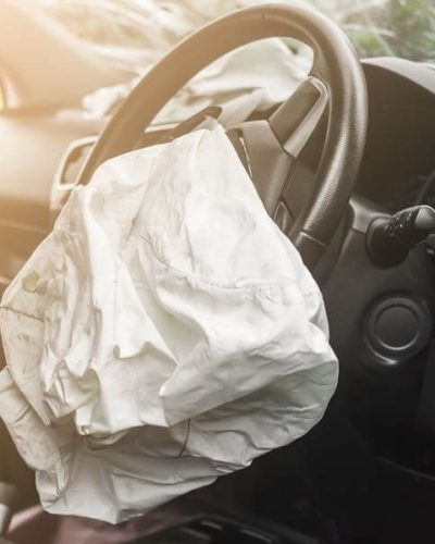 crashed car with deployed airbag