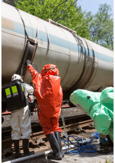 workers in hazmat suits doing maintenance on train