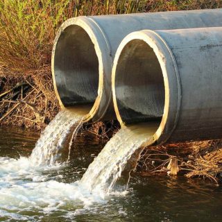 Discharge of sewage into a river