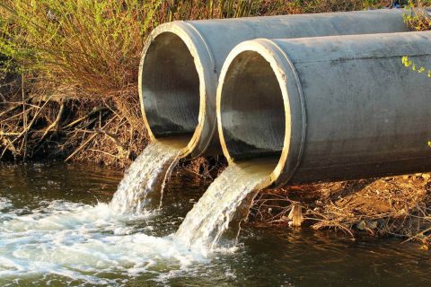 Discharge of sewage into a river